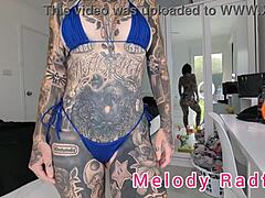 Melody Radford shows off her tattoos in a micro bikini haul
