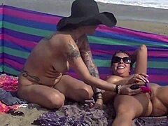 Sensual exhibitionist couple reveals their nudity at the beach